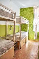 A bed or beds in a room at LOFT HOSTAL Group