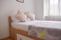 Posteľ alebo postele v izbe v ubytovaní Apartmani Amra