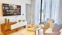 TV a/nebo společenská místnost v ubytování Cana Rock Star, Vista al campo de golf y Piscina C-303, B-400, B-506 y B-502 - Desayuno Incluido