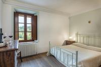 Postel nebo postele na pokoji v ubytování Villa Montepescini