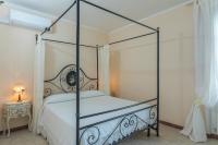 Postel nebo postele na pokoji v ubytování Villa Montepescini