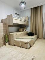 Postel nebo postele na pokoji v ubytování A Luxury 2BR with Big Pools Perfect for Family Summer Escape!