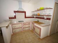 a kitchen with red and white tiles and a sink at Holiday Home in a Nature Reserve in Beaulieu in Beaulieu