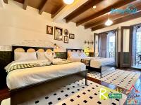 Ein Bett oder Betten in einem Zimmer der Unterkunft Wayfarer Guest House Jonker Street Melaka By Heystay Management
