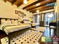 Ein Bett oder Betten in einem Zimmer der Unterkunft Wayfarer Guest House Jonker Street Melaka By Heystay Management