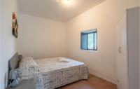 A bed or beds in a room at Nice Home In Modica With Wifi