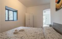 A bed or beds in a room at Nice Home In Modica With Wifi