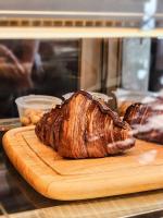 a loaf of bread sitting on a wooden cutting board at Haadson Resort & Koh Raham in Haad Son