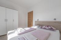 Postel nebo postele na pokoji v ubytování Villa Roma Portorose