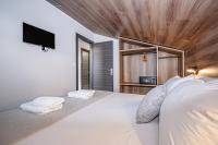Posteľ alebo postele v izbe v ubytovaní Evitel Luxury Living