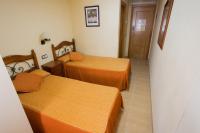 Posteľ alebo postele v izbe v ubytovaní Hotel Beatriz