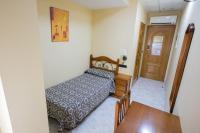 Posteľ alebo postele v izbe v ubytovaní Hotel Beatriz