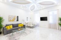 a living room with a couch and a table at Luxurious Central Apartment next to the Danube River in Budapest