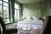 Ein Bett oder Betten in einem Zimmer der Unterkunft 't Hotel