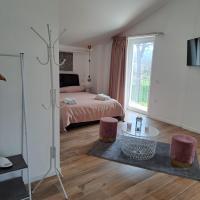 a bedroom with a bed and a table and a window at Nànnì guest home in Pozzovetere