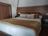 Posteľ alebo postele v izbe v ubytovaní Apartamentos en Leis Muxia
