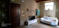 A bed or beds in a room at Appartamento il castellare