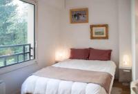 Una cama o camas en una habitaci&oacute;n de Logement entier : appartement &bull; Chez Cecile