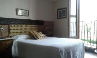 A bed or beds in a room at La Casona del Pastor
