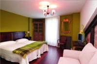 A bed or beds in a room at La Casona del Pastor