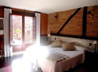 A bed or beds in a room at La Casona del Pastor