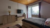 Posteľ alebo postele v izbe v ubytovaní Virágos Apartman Balatonszemes