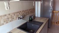 Kuchyňa alebo kuchynka v ubytovaní Virágos Apartman Balatonszemes
