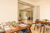 a dining room with a table and chairs at Beverly Hills Hotel in Mount Lavinia