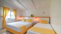 Postel nebo postele na pokoji v ubytování Datça Dirik Surf Beach Hotel