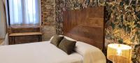 Postel nebo postele na pokoji v ubytování SUITE HAUS BAHIA
