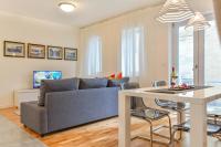 Televízia a/alebo spoločenská miestnosť v ubytovaní Le Monde Apartment