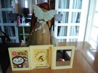 a toy butterfly is sitting next to a box on a table at Xinchuan B&amp;B in Dayi