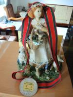 a figurine of a girl in a suitcase with a clock at Xinchuan B&amp;B in Dayi