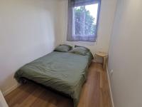 Posteľ alebo postele v izbe v ubytovaní Appartement proche plages