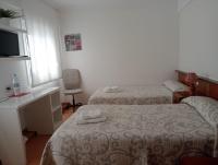A bed or beds in a room at PR La Paz