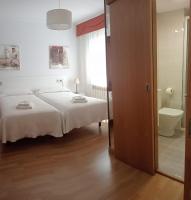 A bed or beds in a room at PR La Paz