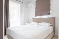 Posteľ alebo postele v izbe v ubytovaní Athanasia Holiday House