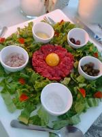 a plate with a salad with an egg on it at Torre del Barbagianni - Castello di Gropparello in Gropparello