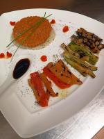 a white plate with different types of food on it at Torre del Barbagianni - Castello di Gropparello in Gropparello