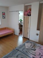 Postel nebo postele na pokoji v ubytování apartman.lara