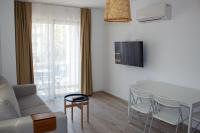 TV a/nebo společenská místnost v ubytování Aloha Suites