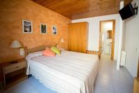 Postel nebo postele na pokoji v ubytování Hotel Ca L'amagat