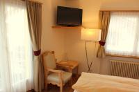 TV a/nebo společenská místnost v ubytování Hotel Conrad