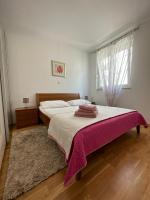 Postel nebo postele na pokoji v ubytování Apartment HAPPY HOME