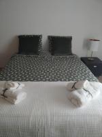 Postel nebo postele na pokoji v ubytování Apartamento em Fuseta - Casa da Praia