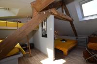 a dorm room with bunk beds and a bed at La porcherie du pet en l&#39;air in Saint Malo