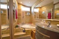 a bathroom with two sinks and a tub at La porcherie du pet en l&#39;air in Saint Malo