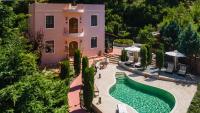 an aerial view of a house with a swimming pool at Butterfly Garden Villa in Pastida