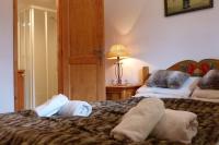 a hotel room with two beds with towels on them at Chataigne, cosy 3 bedroom apartment with great views in Sainte-Foy-Tarentaise