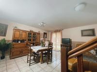 a kitchen with a table and a dining room at La Violette ONLY WOMEN femmes uniquement in Vénissieux